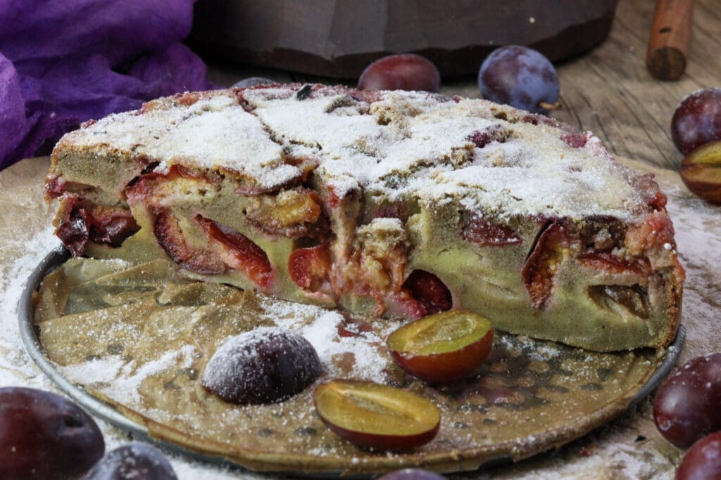 Sliced plum clafoutis - the perfect gluten-free plum dessert.
